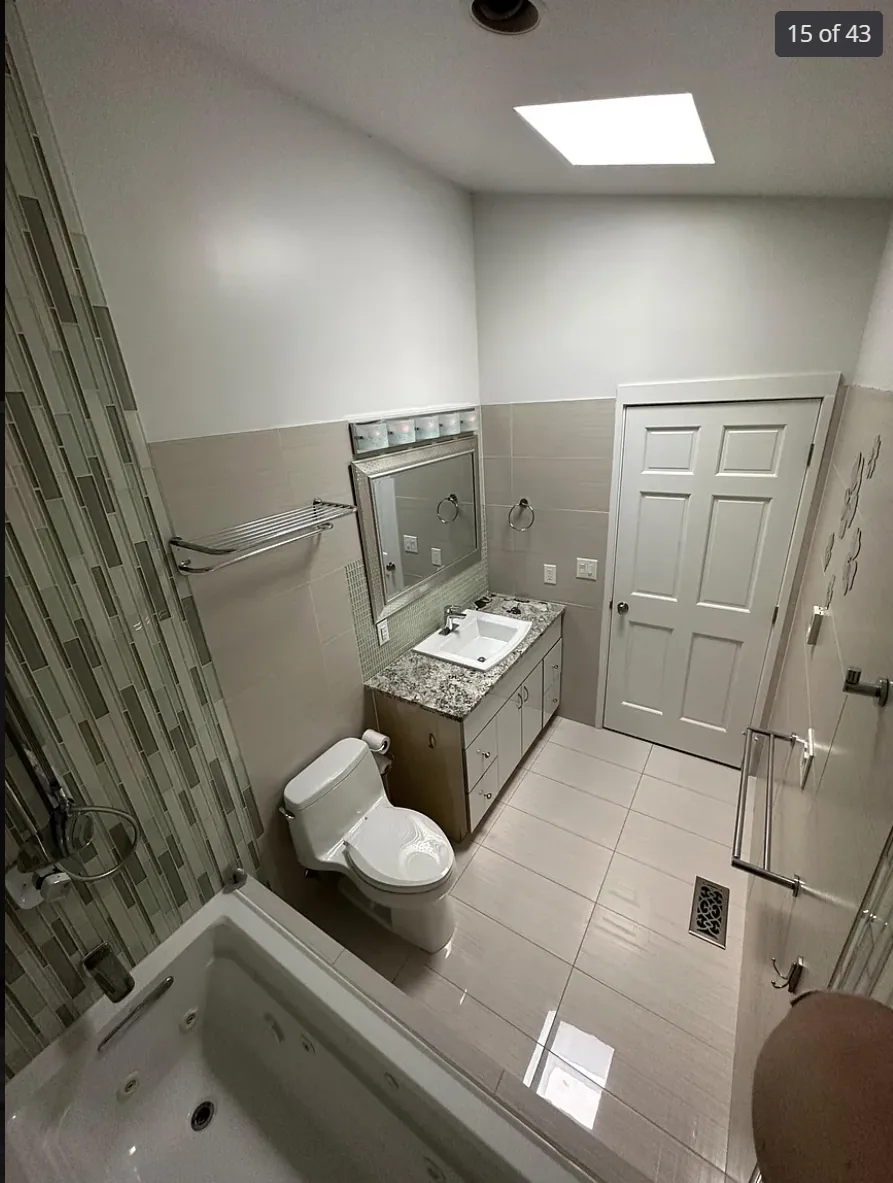 Half bath and laundry room converted into a luxurious bathroom