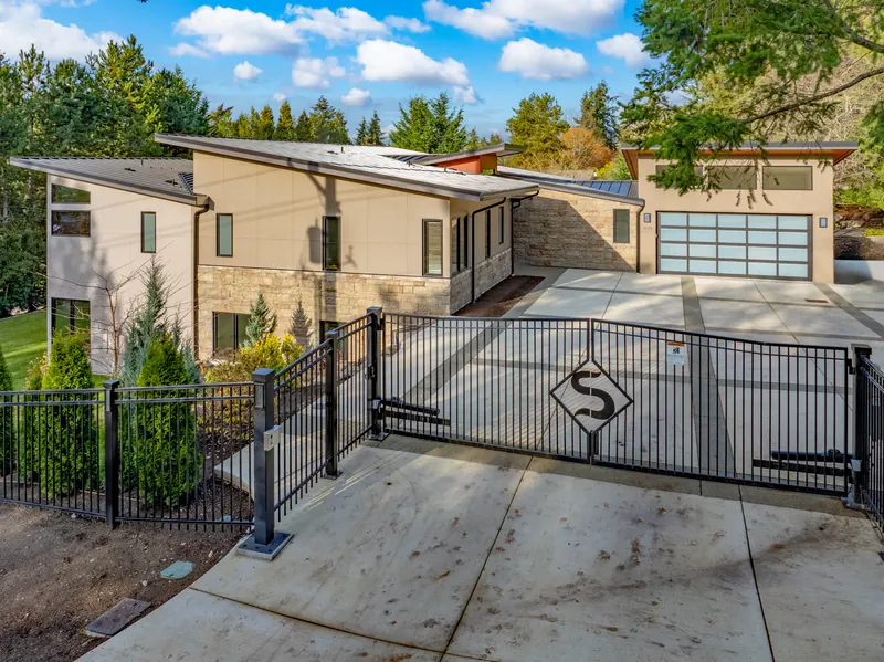 Gated driveway and garage of the modern home