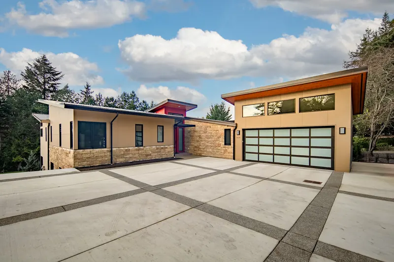Motor court with a concrete driveway in front of the garage