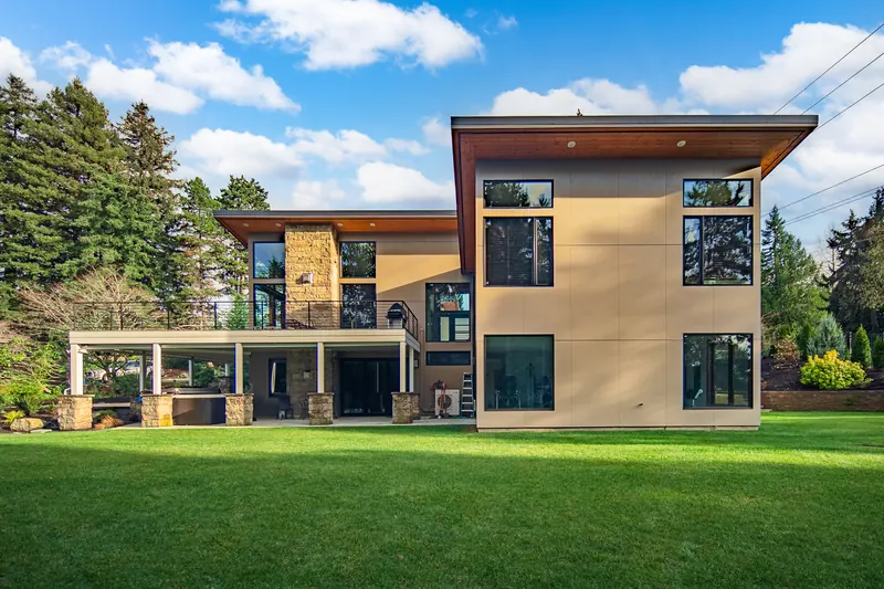 Rear elevation with large windows and a covered patio