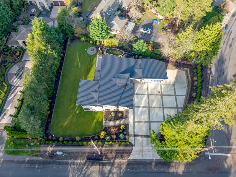 Top-down aerial of the home and the landscaped lot