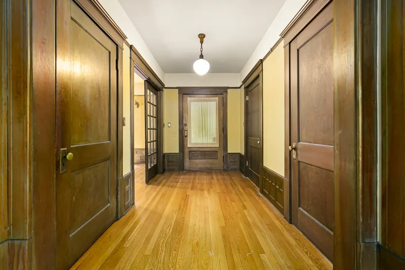Hallway with original wood doors