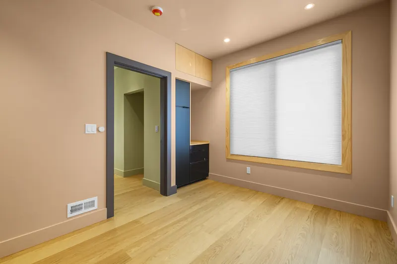 Built-in window bench under large corner windows